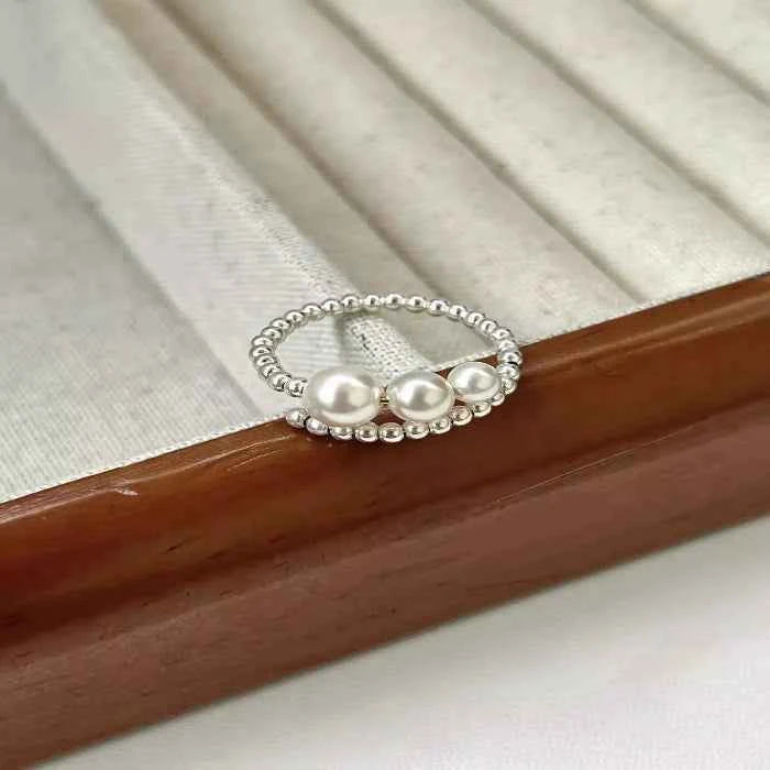 Triple pearl beaded bypass ring — primary view Main image