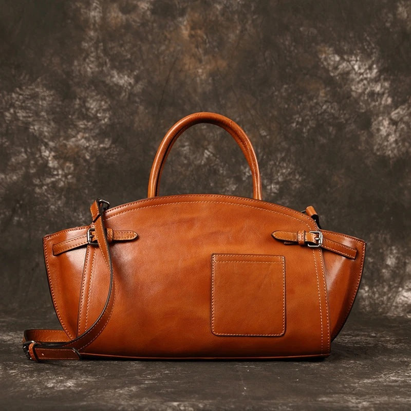 Boston bag shown carried over shoulder