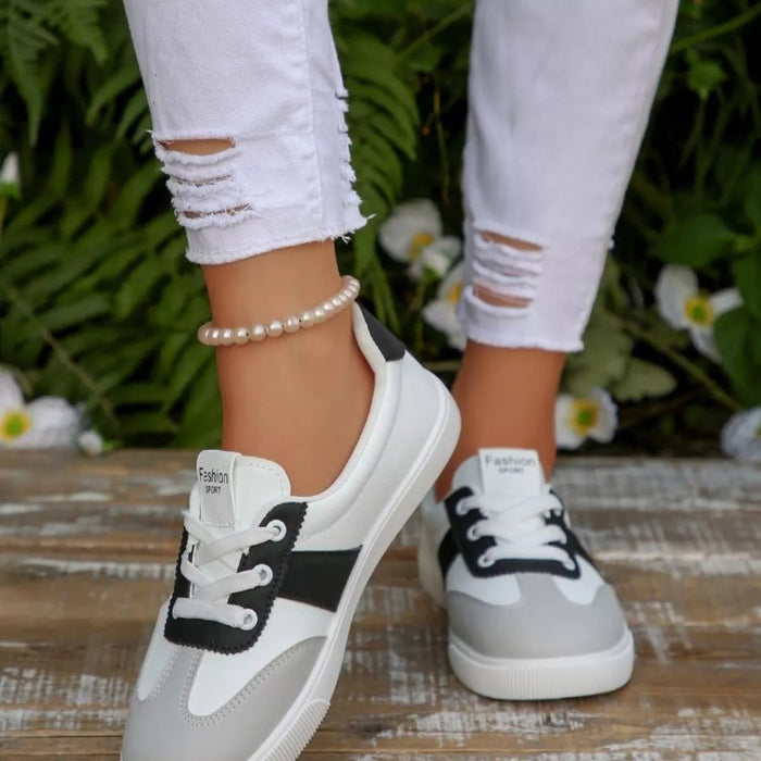 Round toe lace up sneakers in black and red — primary view Main image