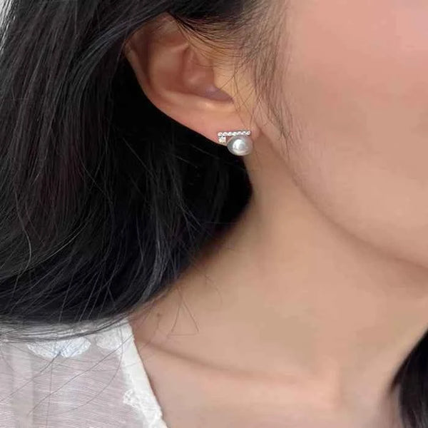 Pearl and zircon stud earrings in 925 silver — primary view