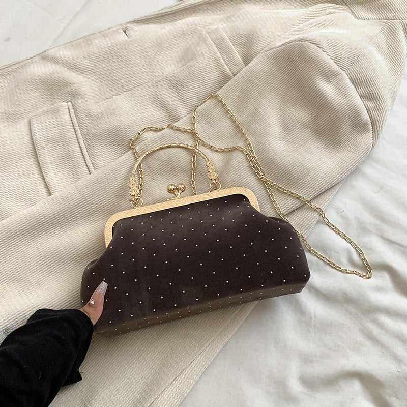 Shell crossbody bag shown styled with an outfit