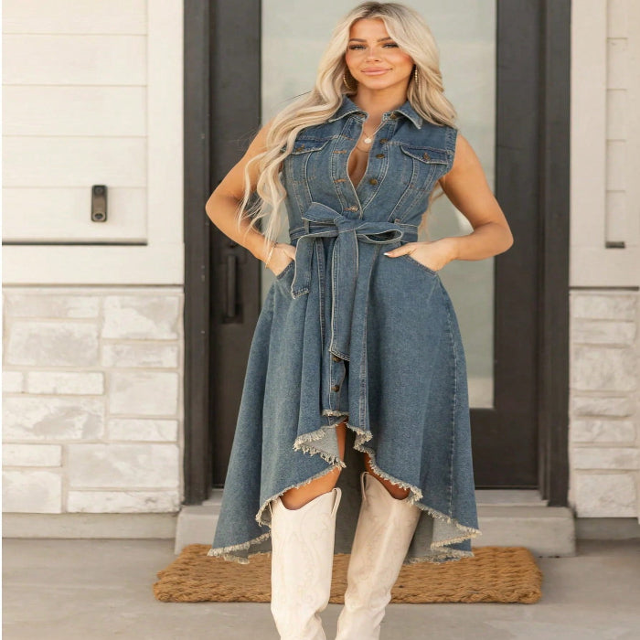 Woman wearing a denim dress with a stone building background